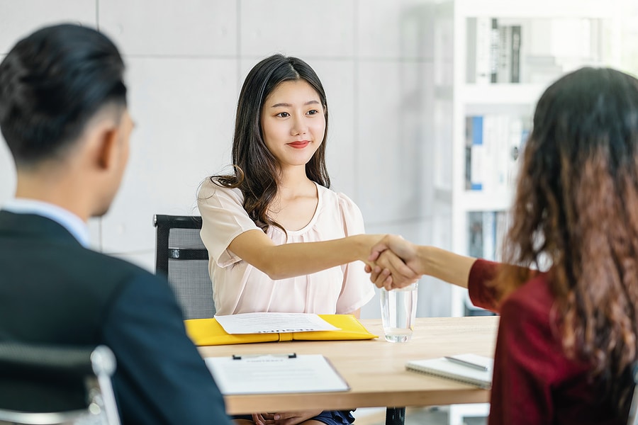 A woman job seeker with two managers before starting a  job interview. 